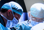 Two surgeons working on a patient